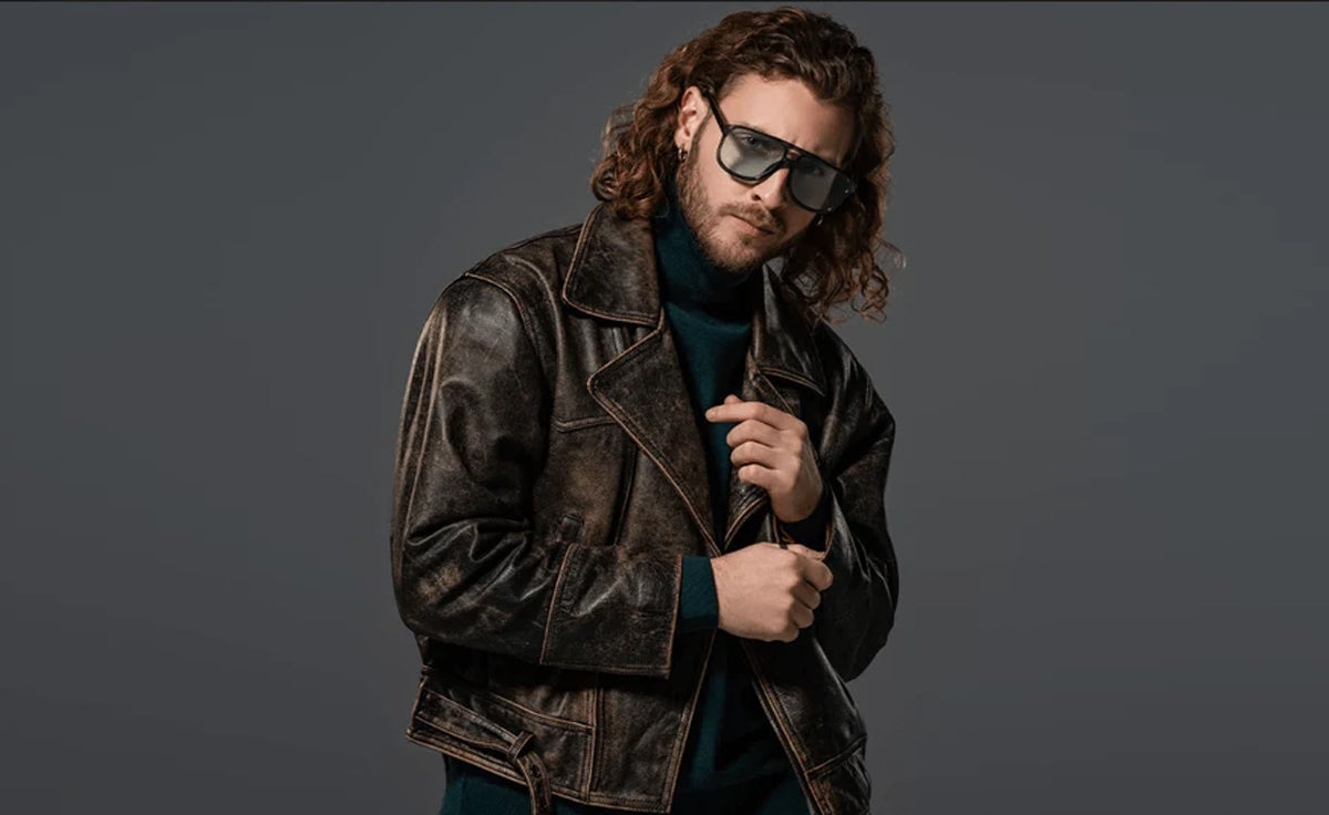 Man wearing a dark brown men’s distressed leather jacket with vintage finish