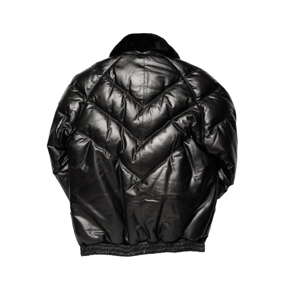 Rear view of black leather down bomber with stacked V channels, center seam and gathered leather waistband
