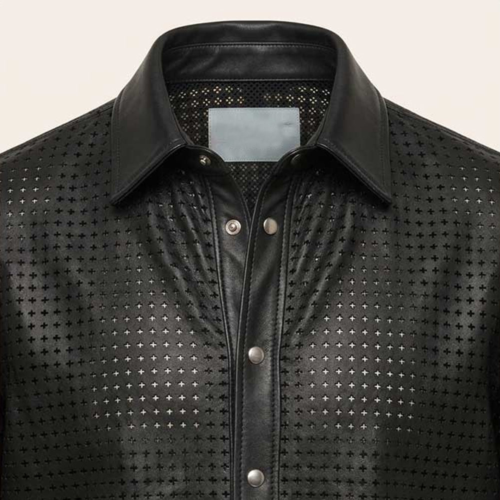 Close-up of cross-shaped leather perforations, smooth black collar and silver-tone snap placket
