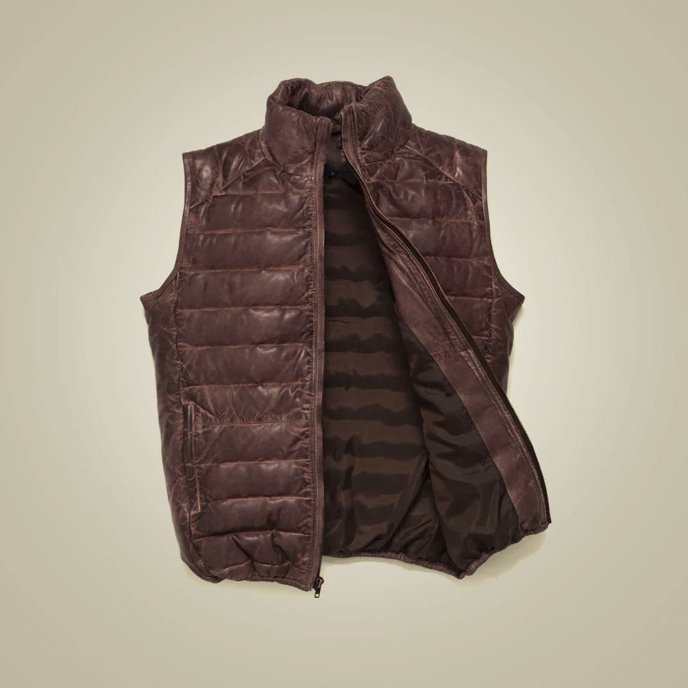Open brown leather down vest displaying smooth satin lining, padded neckline and finished zipper facings