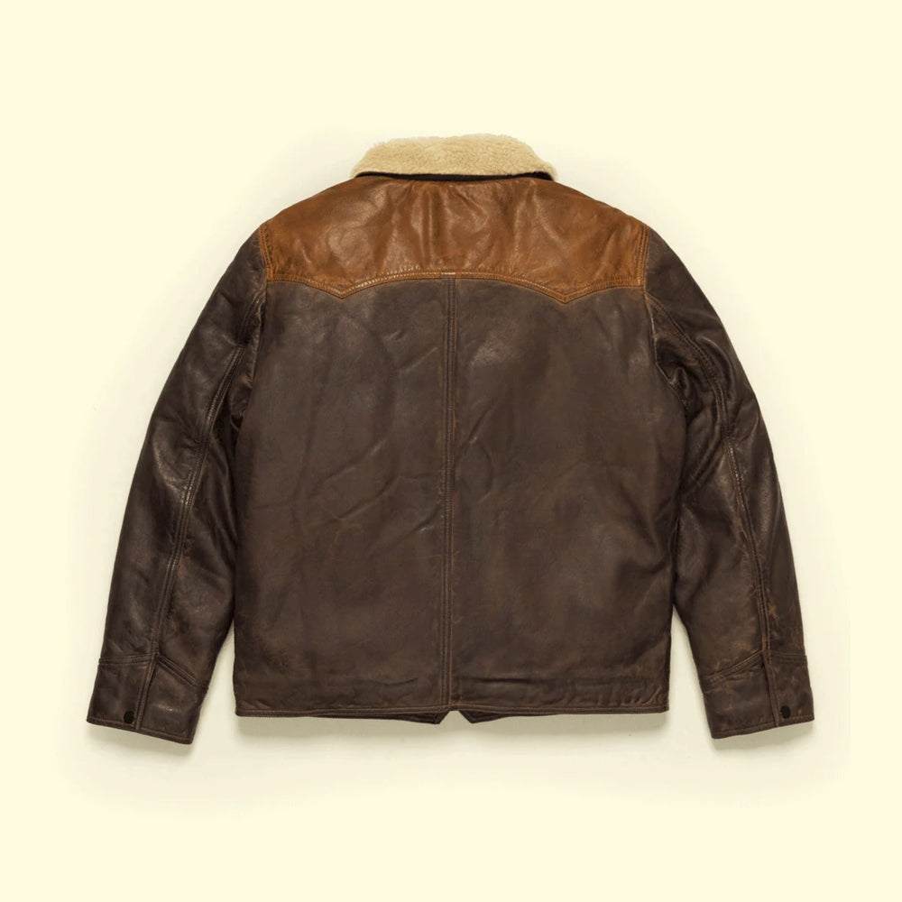 Rear view of brown Western leather jacket showing the pointed cognac yoke and vertical center-back seam