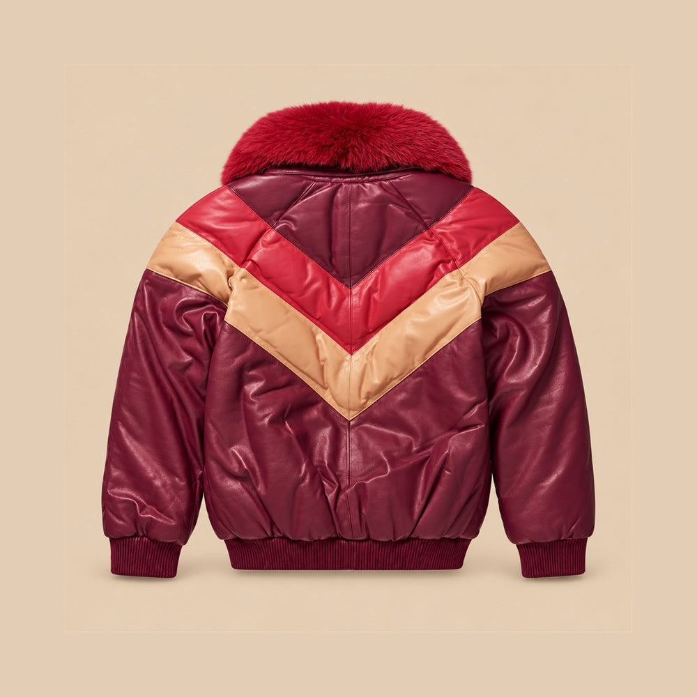 Rear view of burgundy leather V-Bomber showing red and camel double-chevron panels, pointed back yoke, center seam and matching ribbed waistband.