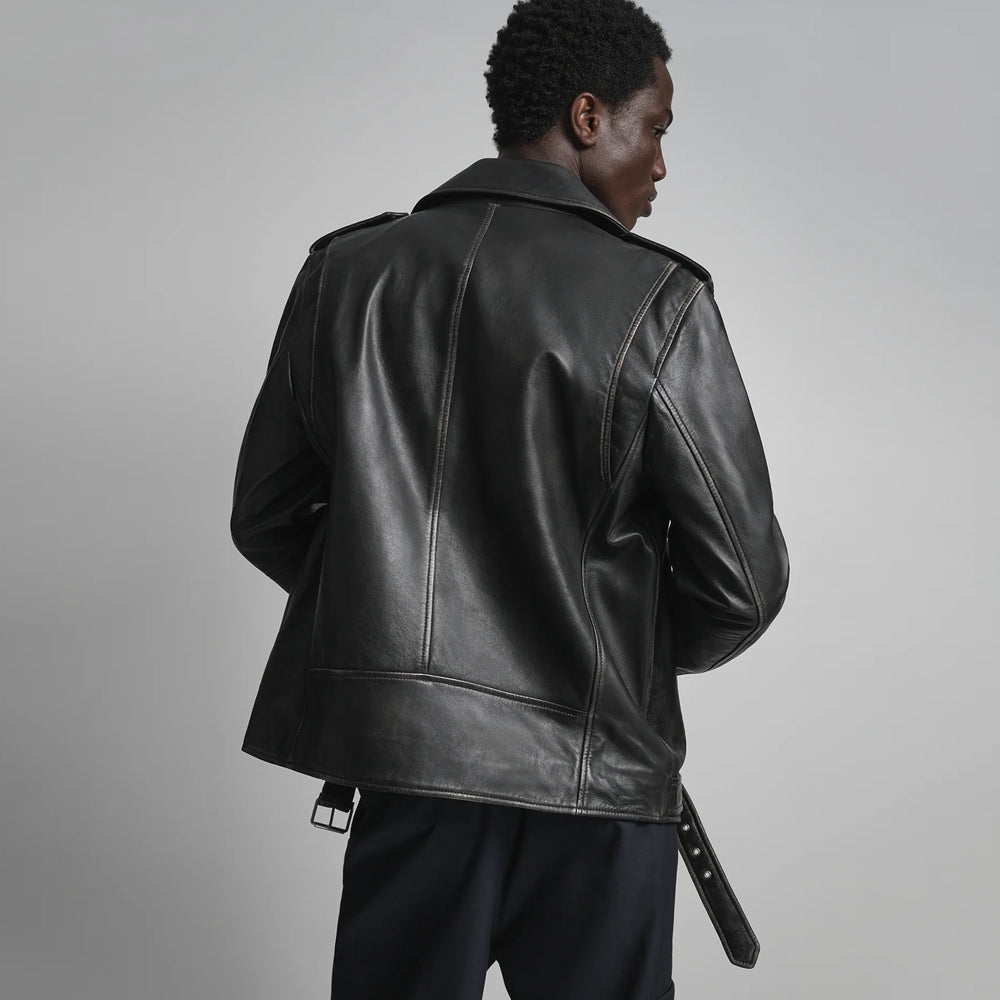 Rear view of classic black double-rider jacket showing central seam, curved side shaping and structured lower panel