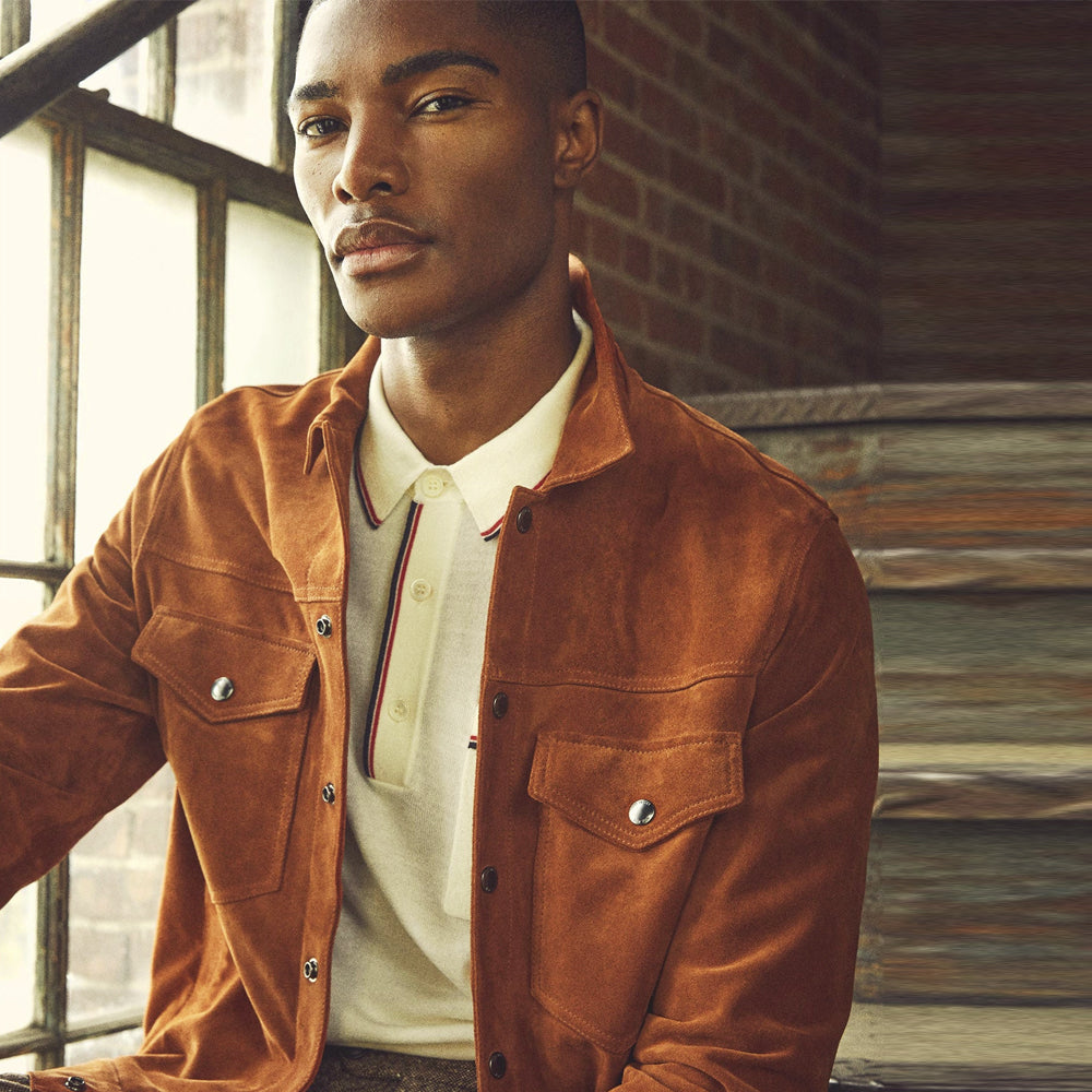 Close lifestyle view of cognac suede Type III jacket showing point collar, chest yoke and snap-flap pockets
