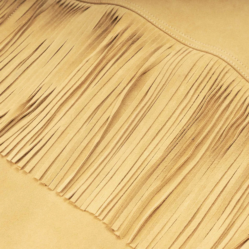 Detailed view of finely cut sleeve fringe and velvety cowhide nubuck texture in a warm beige tone