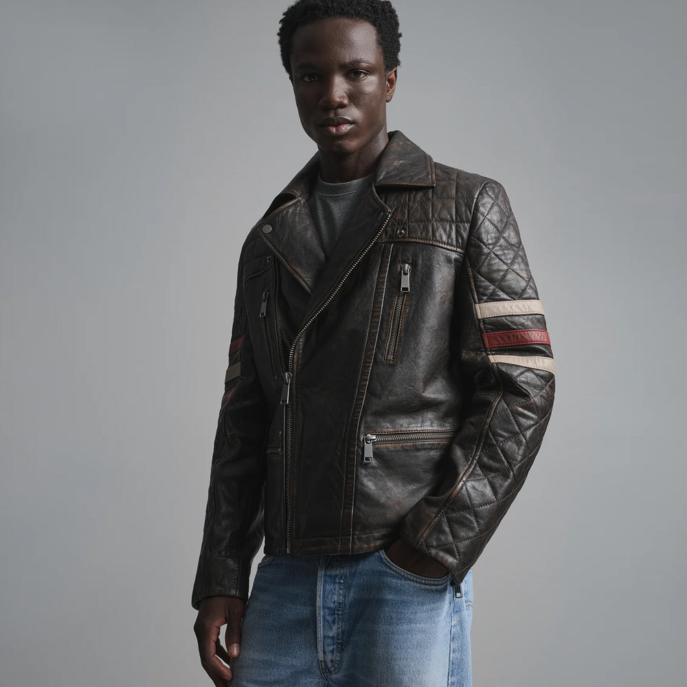 Three-quarter view of dark brown quilted moto jacket featuring distressed finish, waist zip pocket and racing stripes