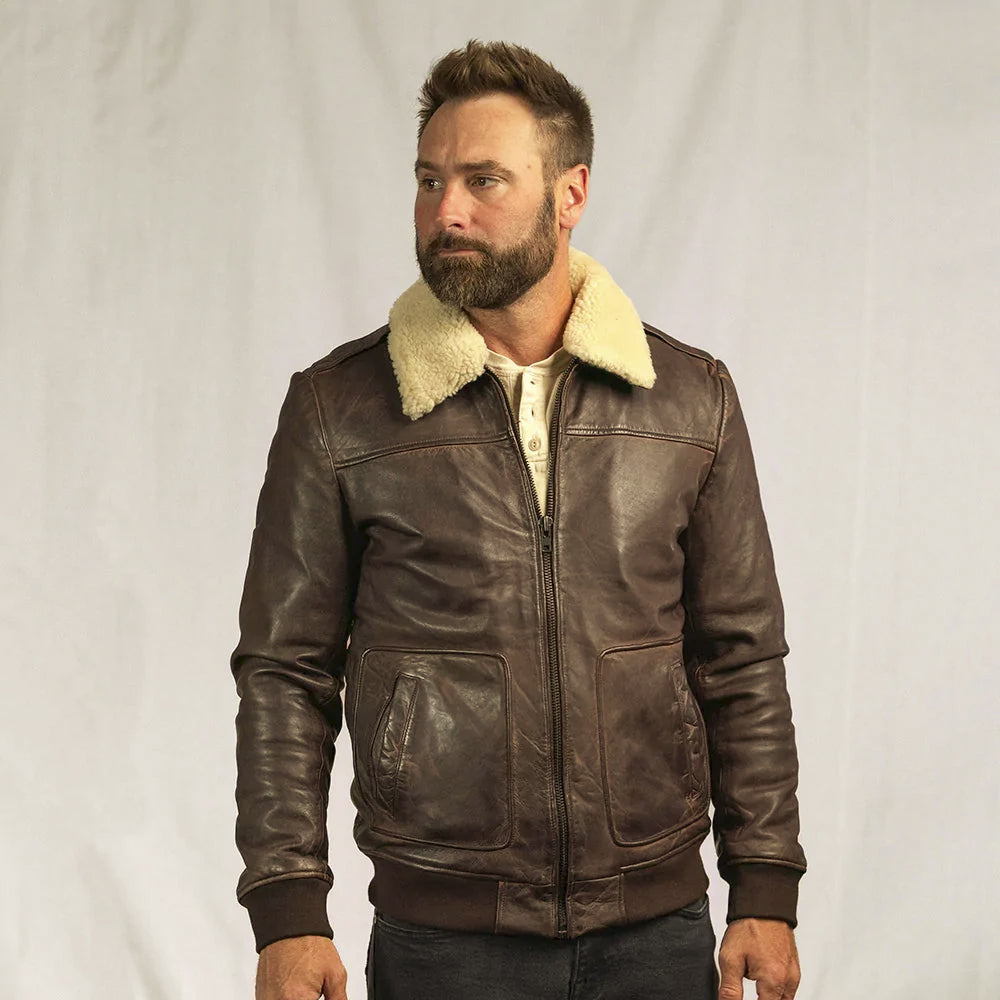Men’s distressed brown A-2-inspired leather flight jacket with ribbed cuffs and patch hand pockets