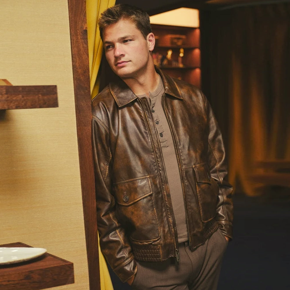 Man wearing a distressed cowhide bomber jacket with point collar, YKK zipper, and oversized utility pockets