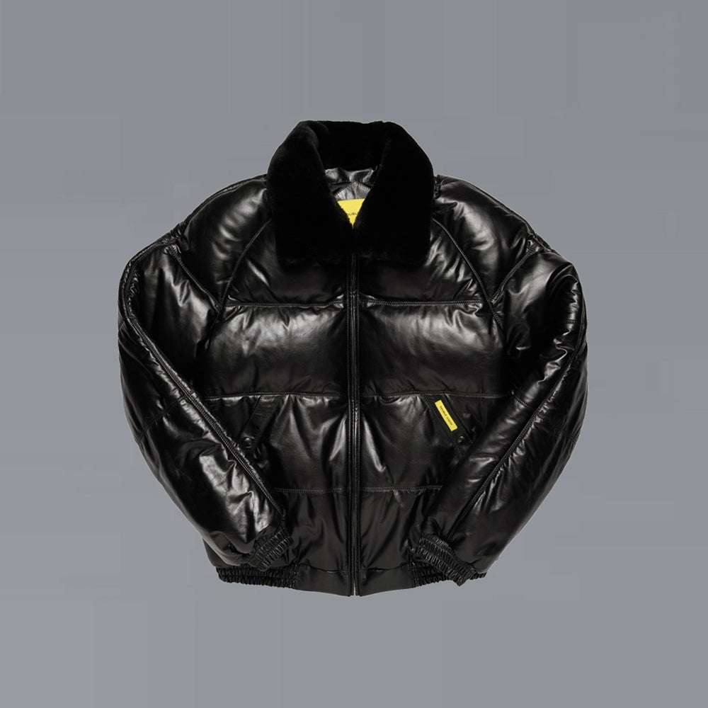 Front view of Double Goose black calfskin puffer with horizontal down channels, detachable shearling collar and snap welt pockets.