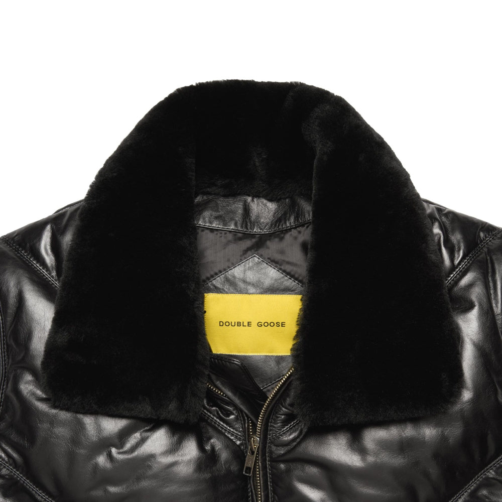 Close-up of plush black shearling collar, polished calfskin shell and yellow Double Goose interior label.
