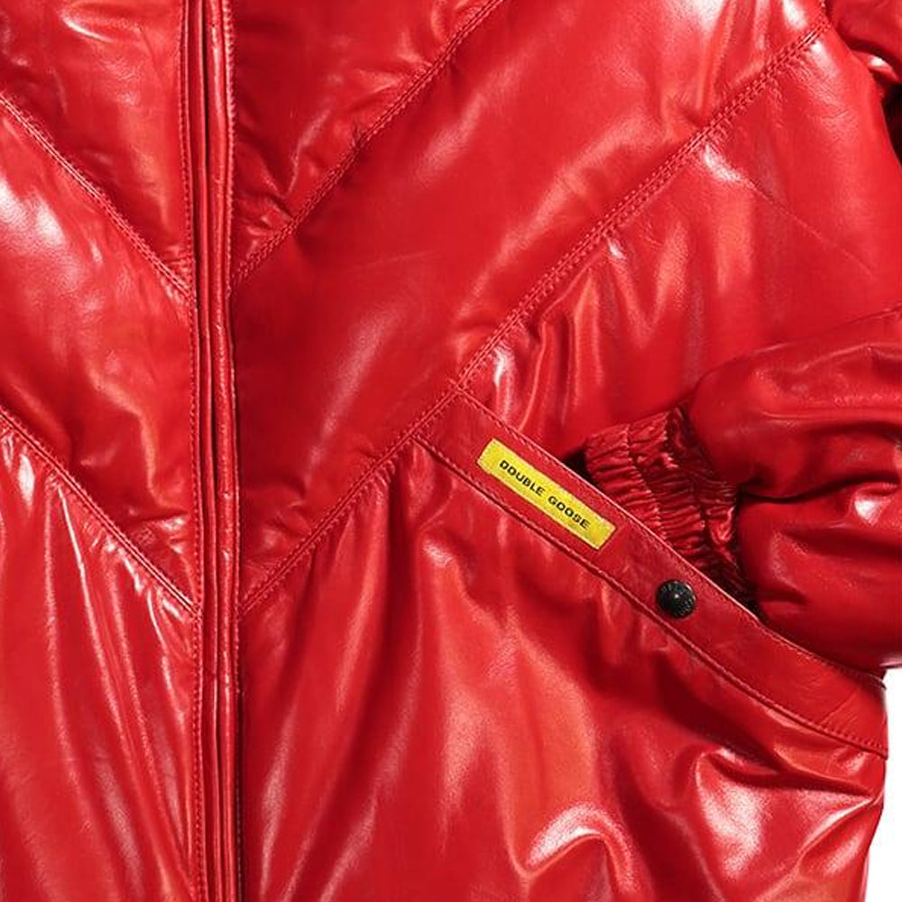 Angled welt pocket with branded snap and yellow Double Goose tab on the glossy Chili red leather shell