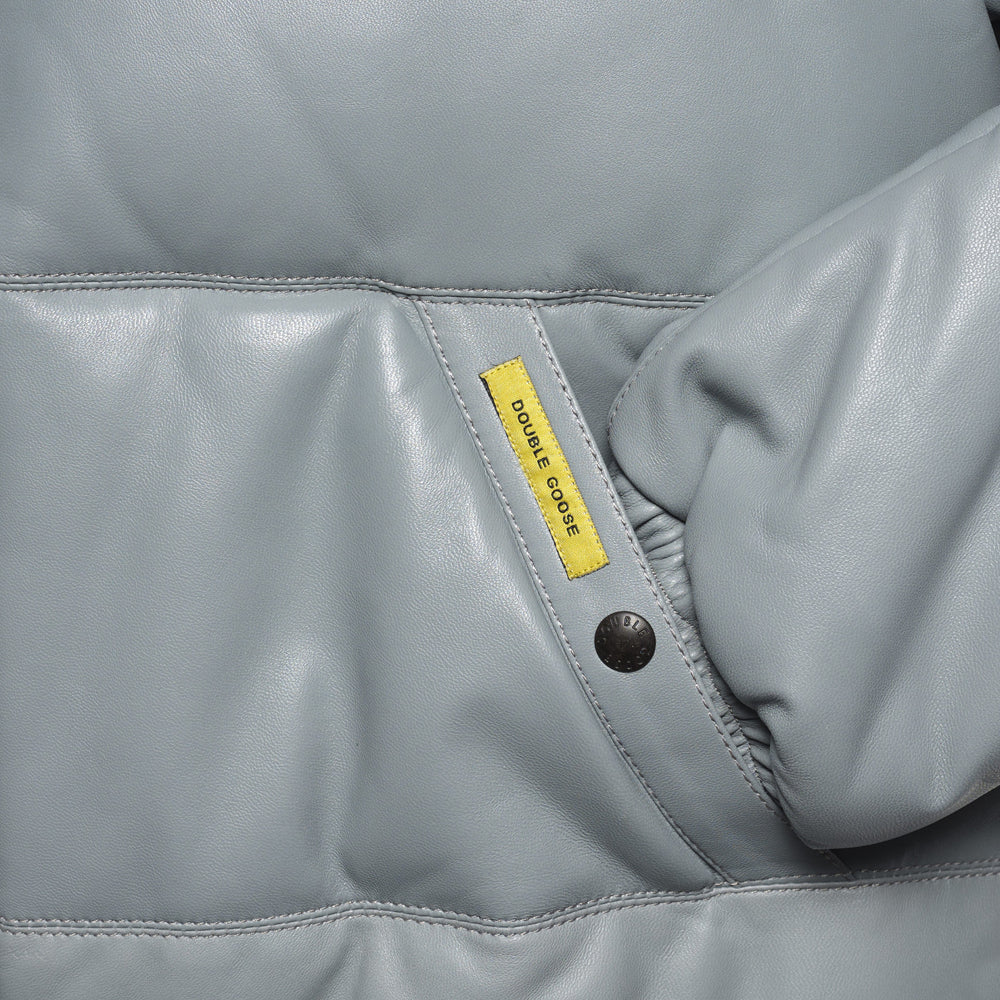 Angled light grey welt pocket with branded snap, yellow Double Goose tab and gathered leather cuff