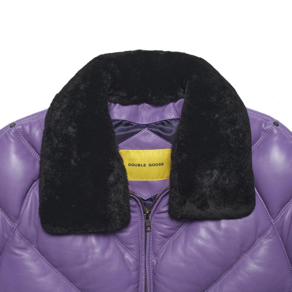 Close-up of plush black sheep-wool collar, lilac lambskin quilting and yellow Double Goose interior label