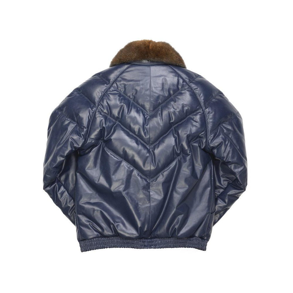 Back view of the navy Double Goose leather bomber showing layered V channels, center seam and gathered waistband