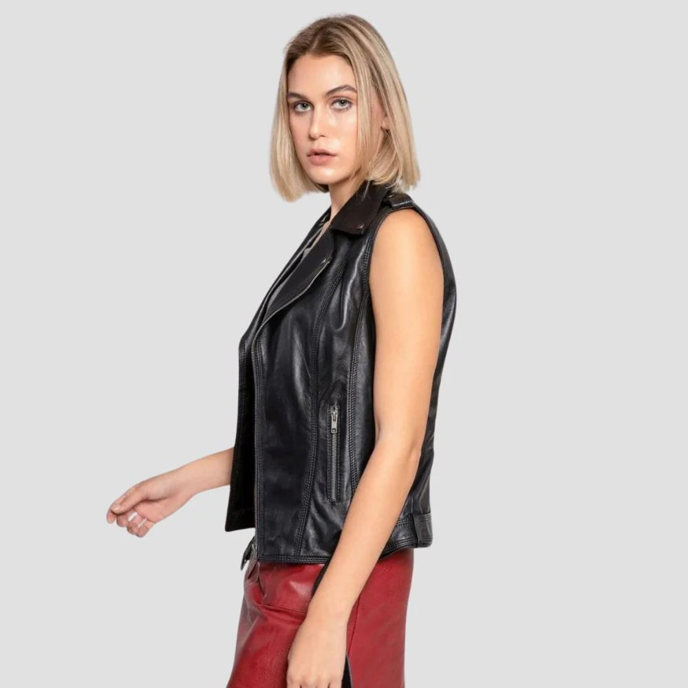 Side view of fitted black sheepskin leather gilet showing shaped armhole, vertical pocket zipper and hip-length hem