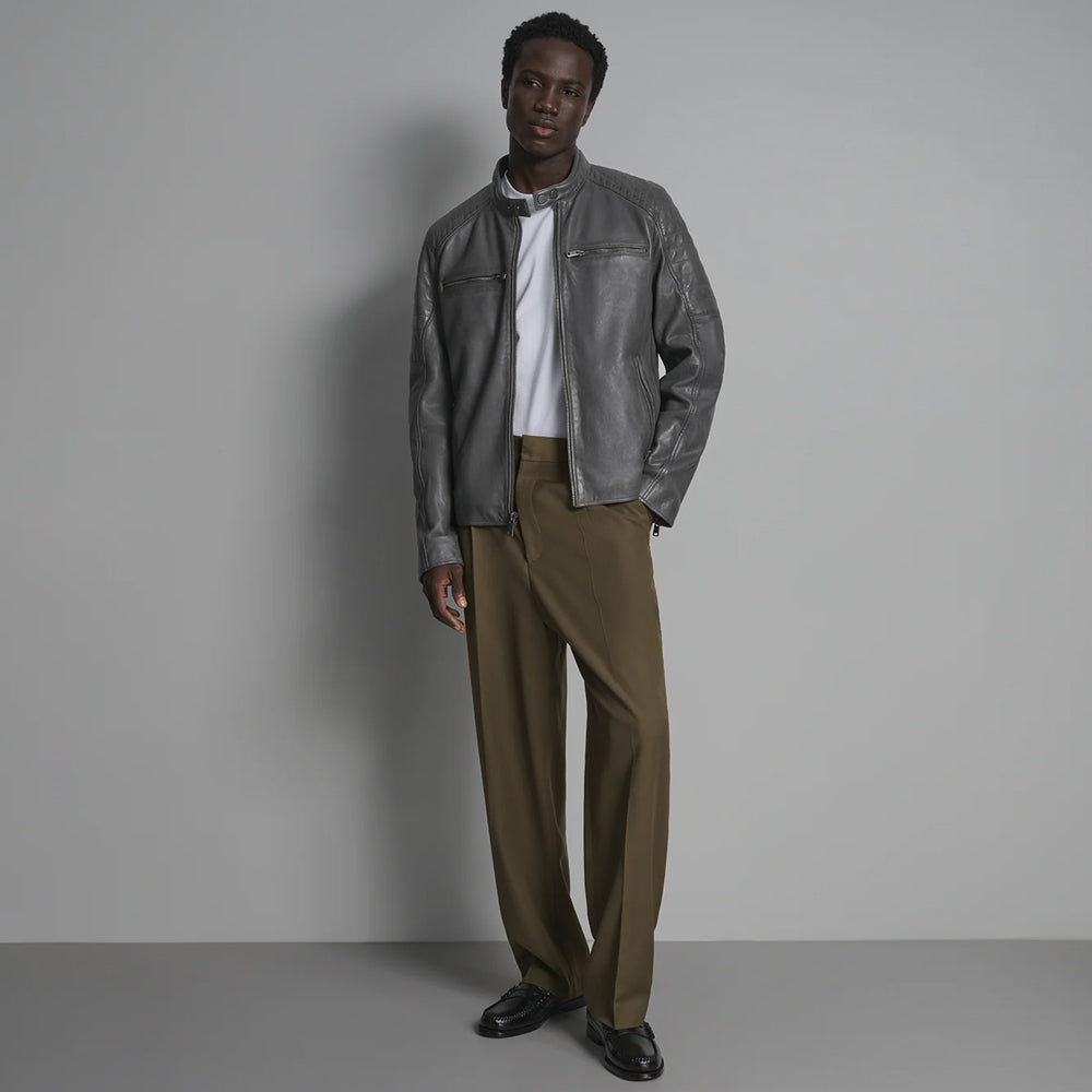 Full styling view of four-pocket graphite leather jacket with straight zipper, band collar and olive trousers