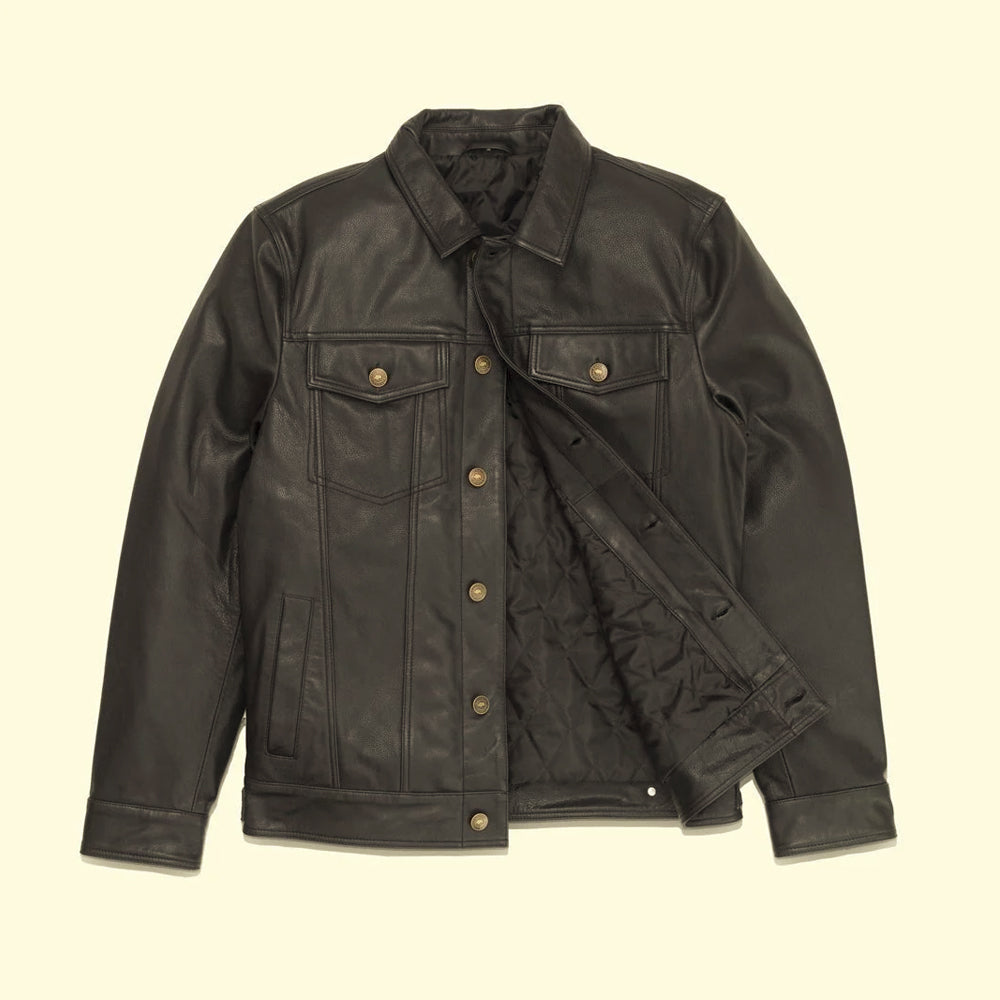 Open flat-lay view of the full-grain cowhide trucker jacket displaying its button front and black quilted lining