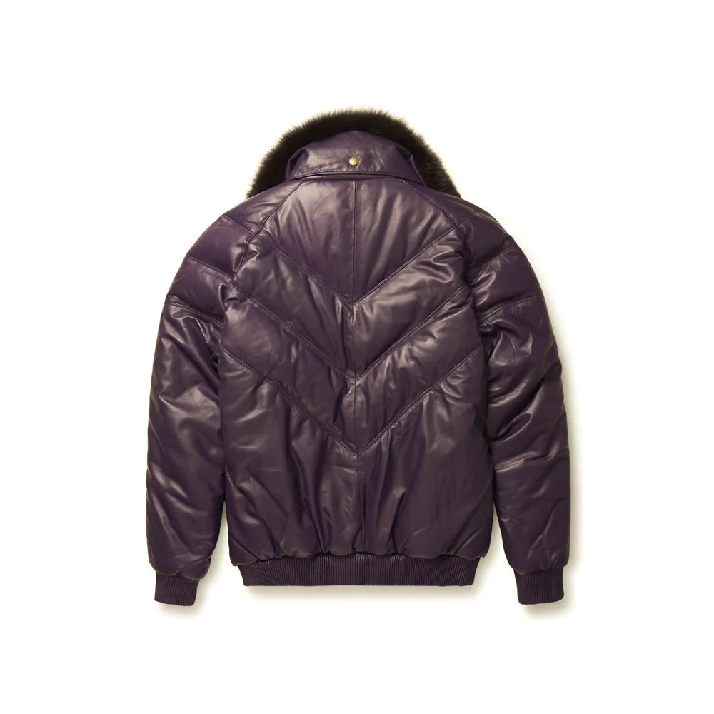 Back view of Goose Country aubergine leather puffer jacket with layered V-channel seams, detachable fur collar and rib-knit hem