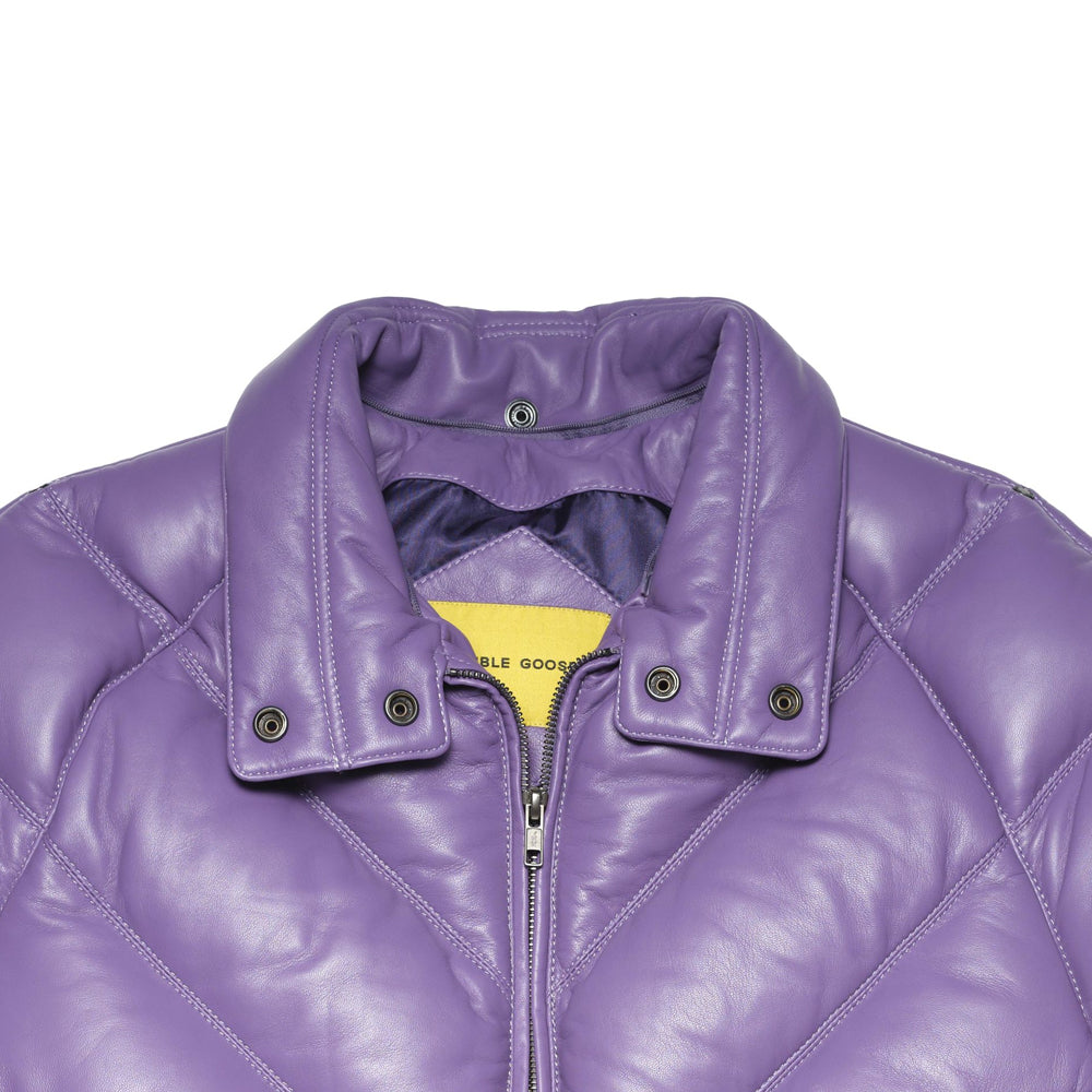 Detail of lilac padded collar showing snap hardware after removal of the contrasting black wool attachment