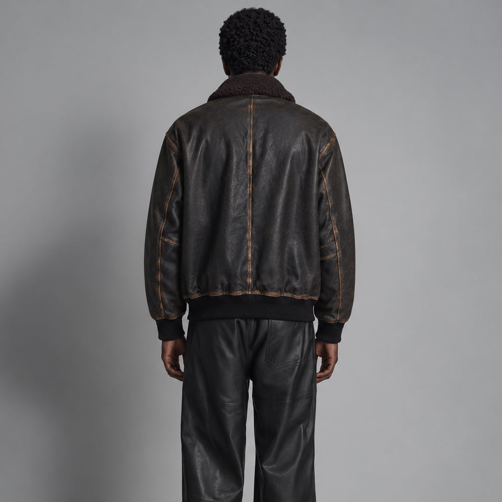Full rear view of men’s A-2 flight jacket showing plain back panels, single center seam and rib-knit waistband