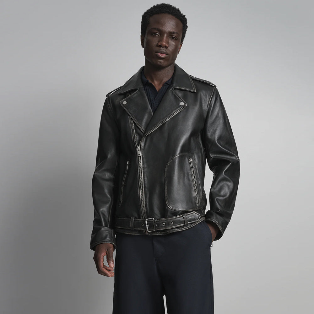 Front view of men’s black belted leather biker jacket with asymmetrical zipper, snap lapels and curved zip pockets