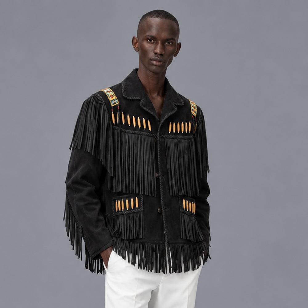 Model wearing men’s black Western fringe jacket with notched lapels, decorated pockets and layered shoulder tassels