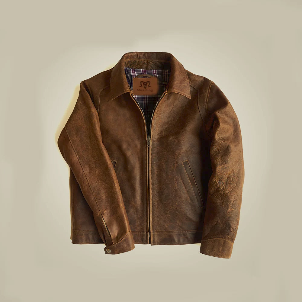 Front flat lay of a men’s brown crazy horse leather jacket with point collar, YKK zipper and slanted pockets