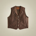Front view of men’s brown cowhide ranch vest with broad notch lapels, buffalo-nickel snaps and welt pockets