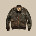 Front view of men’s burnished brown A-2 cowhide flight jacket with epaulettes and snap-flap pockets