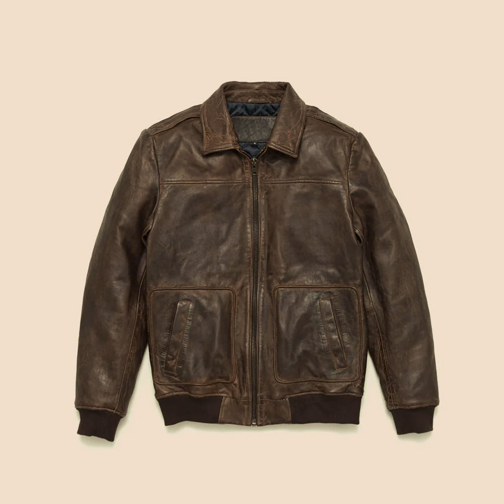 Front flat-lay of men’s double-tone brown cowhide bomber jacket with patch pockets and ribbed trim