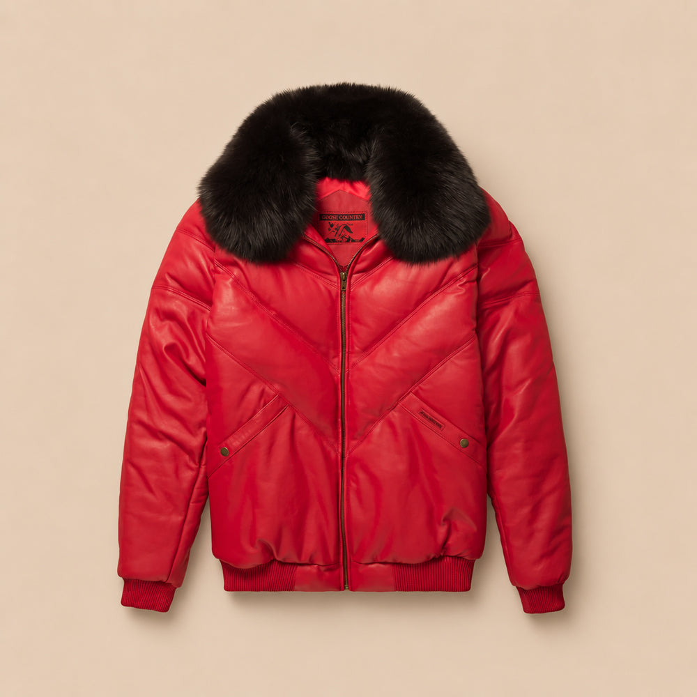 Front view of men's Goose Country red leather V-bomber jacket with tonal chevron panels and detachable black fox-fur collar.