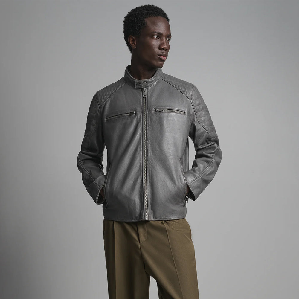 Front view of men’s graphite leather moto jacket with dual-snap collar, horizontal chest zippers and quilted shoulders