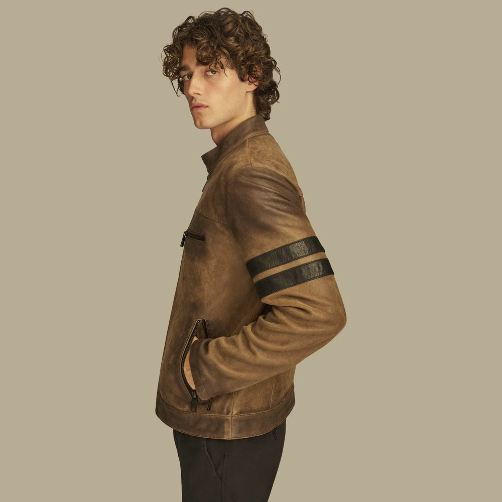 Side profile highlighting twin black leather stripes on the upper sleeve of a brown racing jacket