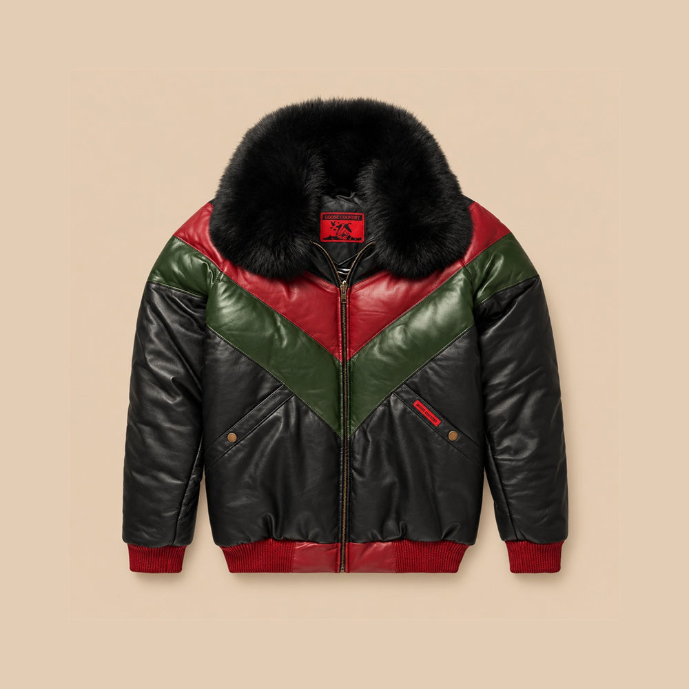 Front view of men’s Original Goose Country black lambskin V-Bomber with crimson-red and forest-green chevron panels, black fur collar and red rib-knit trim.