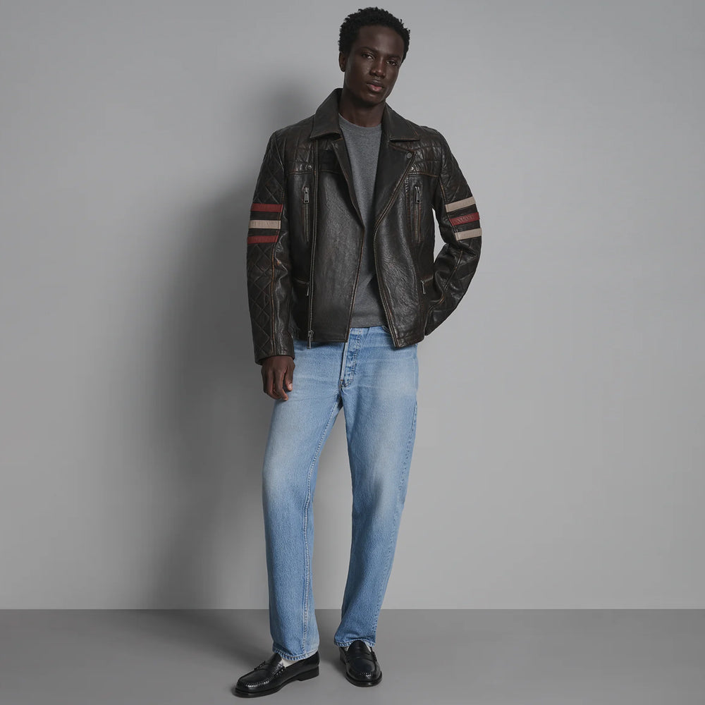 Full-length styling of men’s racing-stripe leather jacket with light denim, gray shirt and black shoes