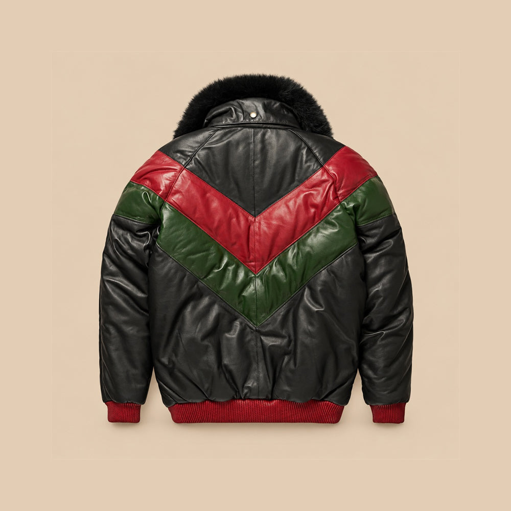 Back view of men’s red, forest-green and black leather V-Bomber showing stacked chevrons, black pointed yoke, center seam and red ribbed waistband.