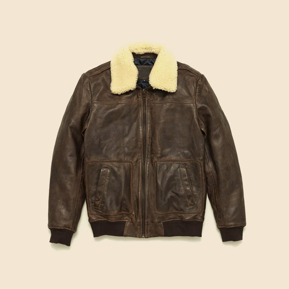 Front flat-lay of men’s vintage brown cowhide aviator bomber with removable cream shearling collar