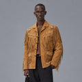 Model wearing men’s Western boar suede jacket with notched lapels, bone-and-bead trim and layered cognac fringe