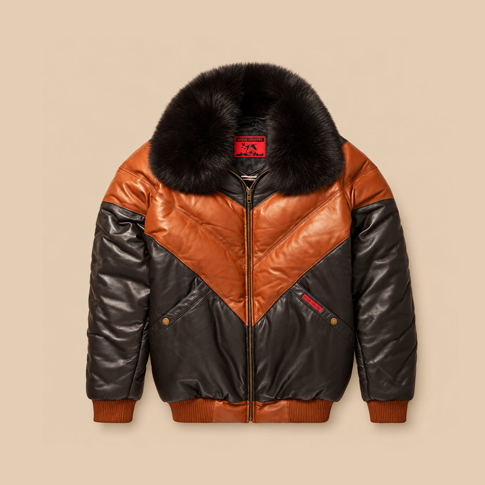 Front view of men’s Original Goose Country brown leather V-Bomber with cognac chevron panels and detachable black fox-fur collar.