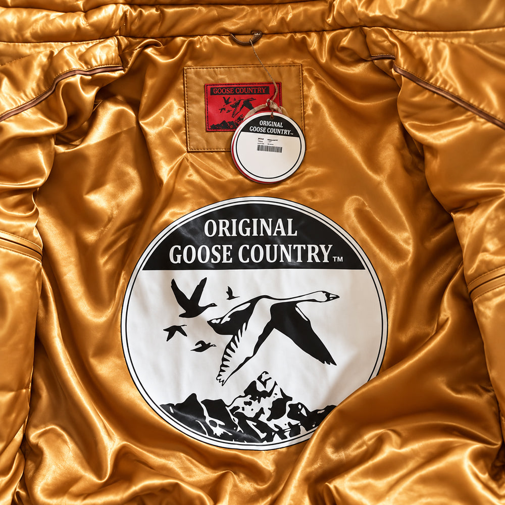 Golden satin interior with logo patch inside the Original Goose Country men's cognac leather V-bomber jacket.