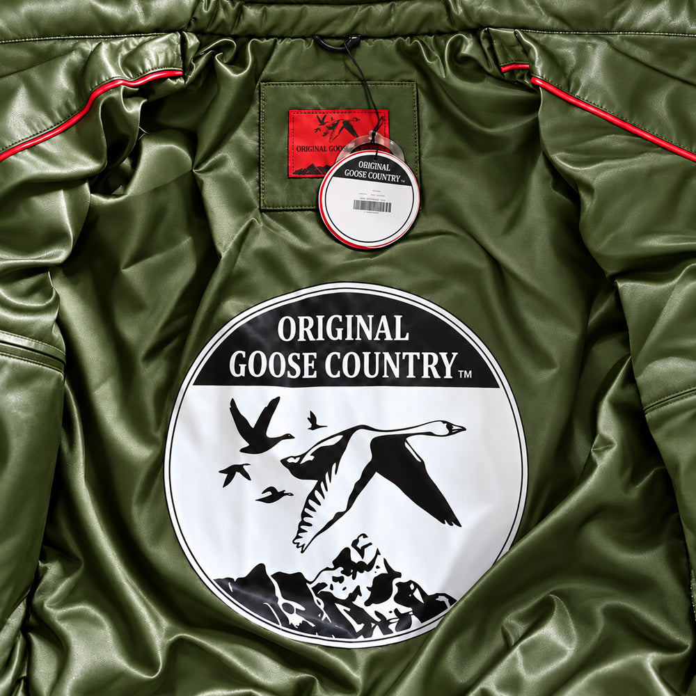 Olive satin lining inside Original Goose Country jacket with circular goose emblem, red neck label and contrast piping.