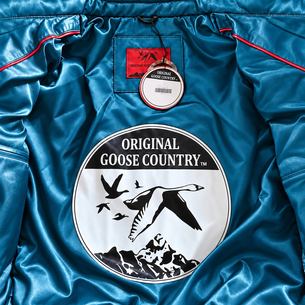 Teal satin Original Goose Country jacket lining with circular goose emblem, red woven label, hangtag and contrast piping.