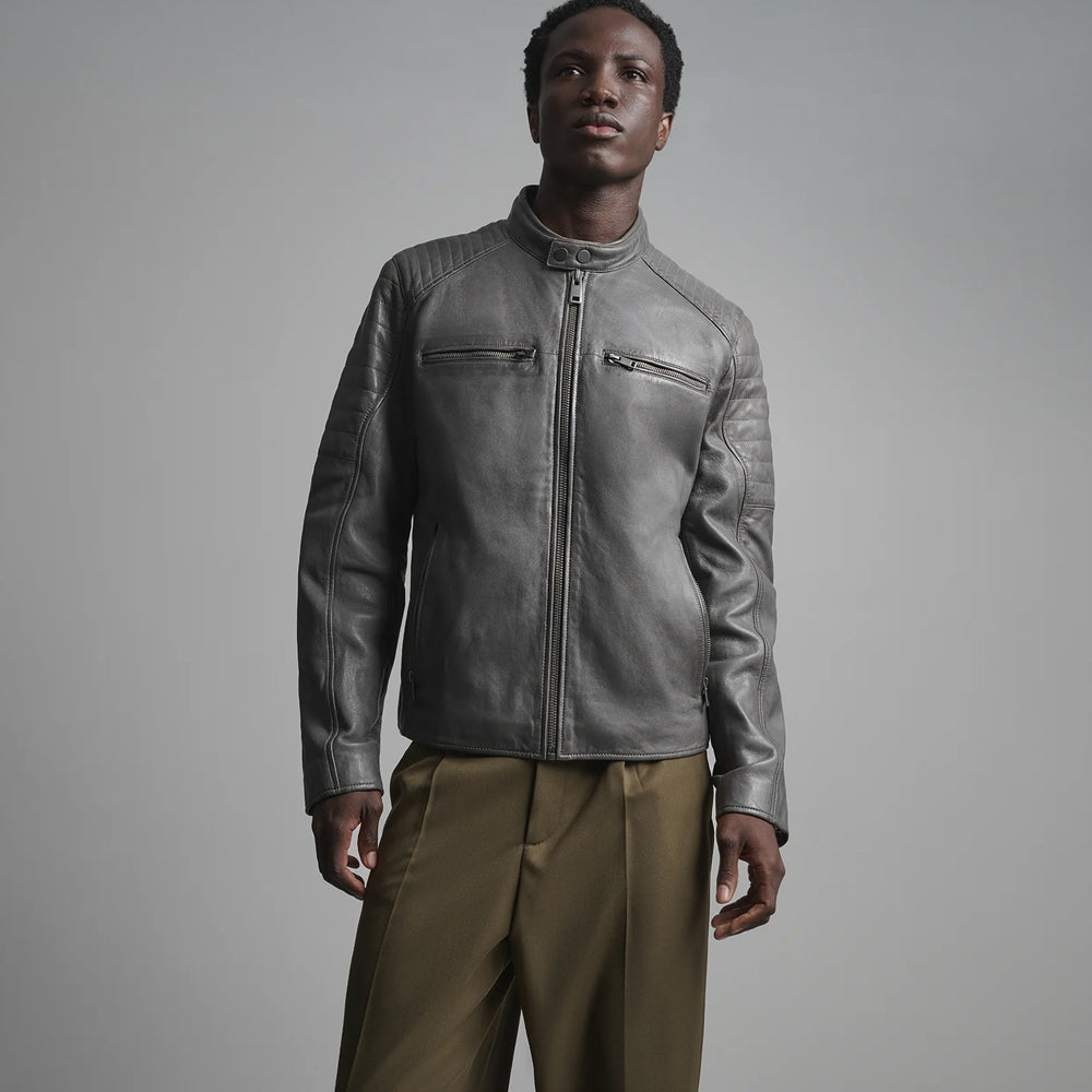 Close front view of gray leather racer jacket displaying snap-tab neckline, ribbed shoulders and symmetrical chest pockets