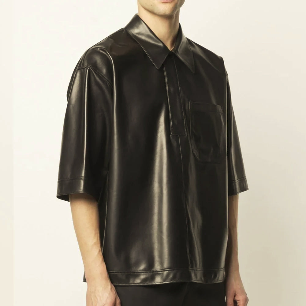 Three-quarter view of relaxed-fit black sheepskin leather half-sleeve shirt with single chest patch pocket