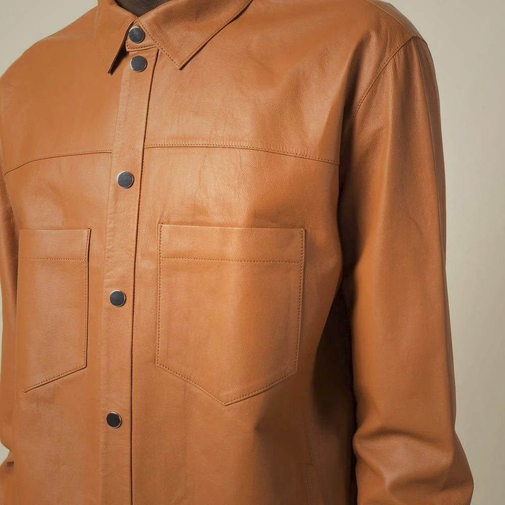 Close-up of smooth sheepskin leather shirt with open patch pockets, tonal stitching and mixed-tone round buttons