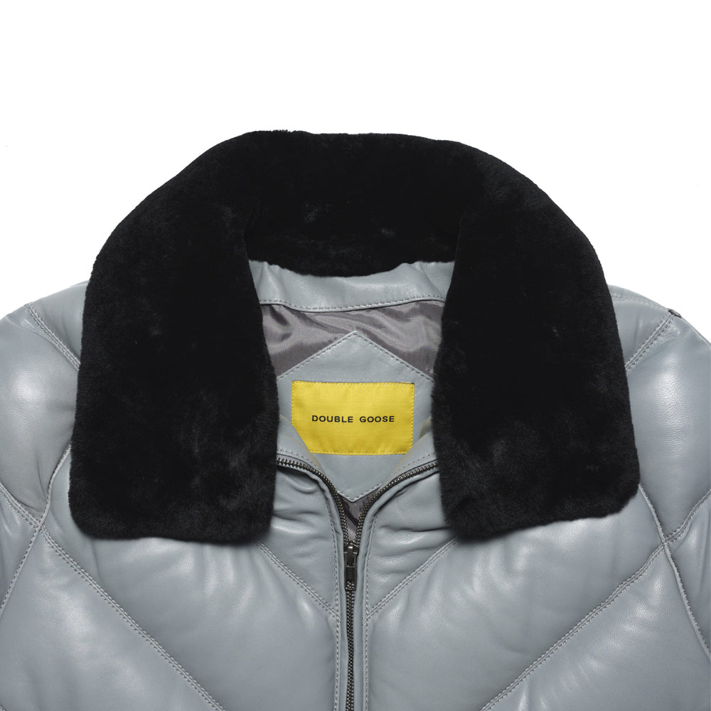 Detachable black shearling-wool collar fitted to a silver-grey lambskin puffer with V-shaped shoulder seams