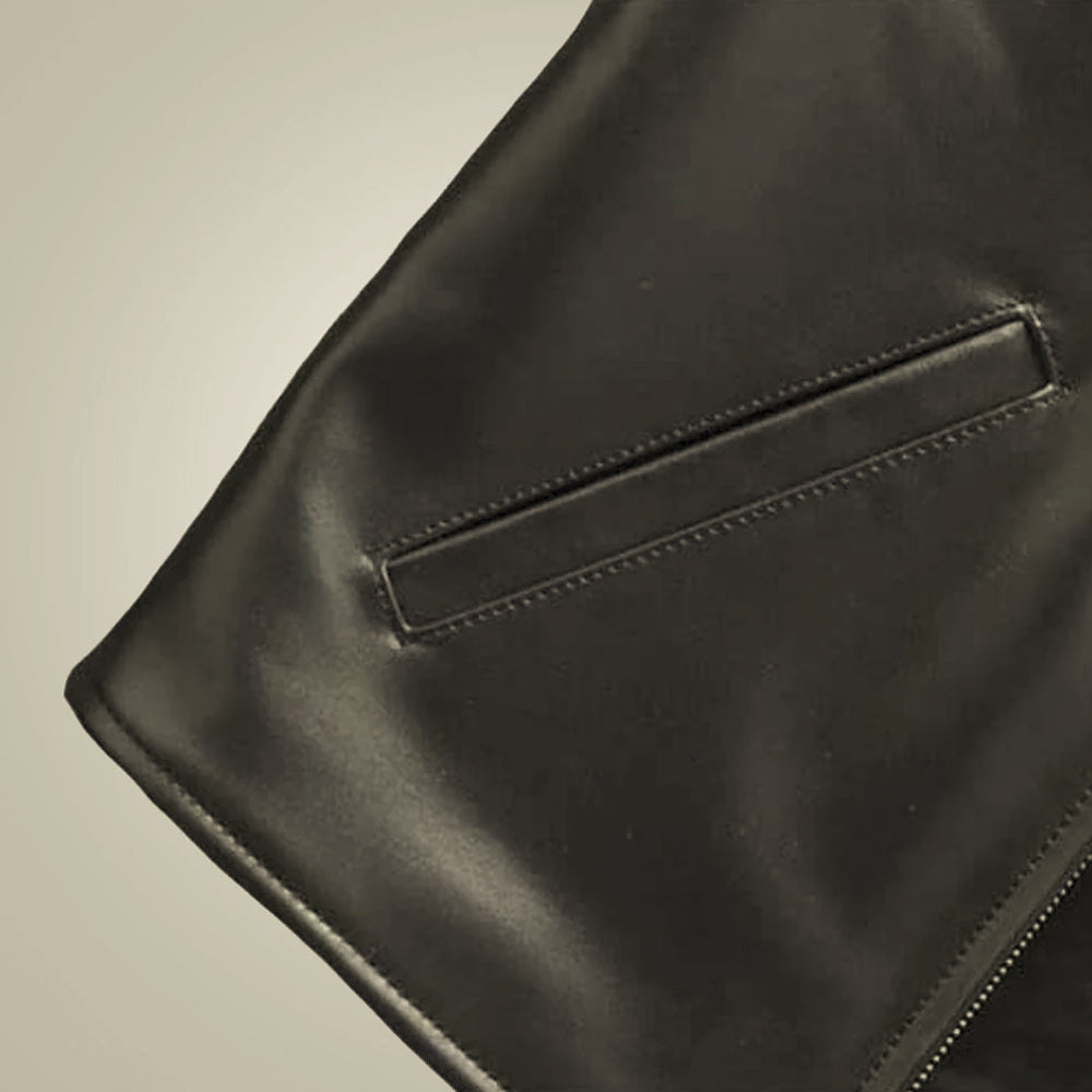 Close view of smooth black sheepskin leather, tonal stitching and neatly trimmed lower pocket opening