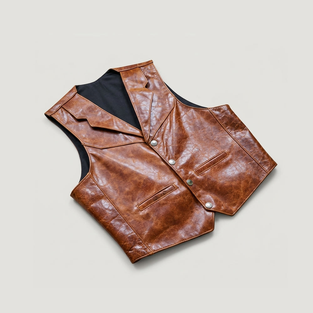 Angled view of vintage brown leather ranch vest highlighting layered lapels, snap front and pointed hem