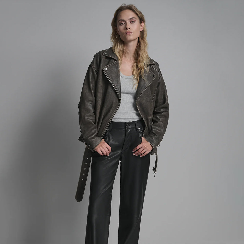 Oversized distressed leather biker jacket with open front, showcasing antique brass zipper and wide lapels.