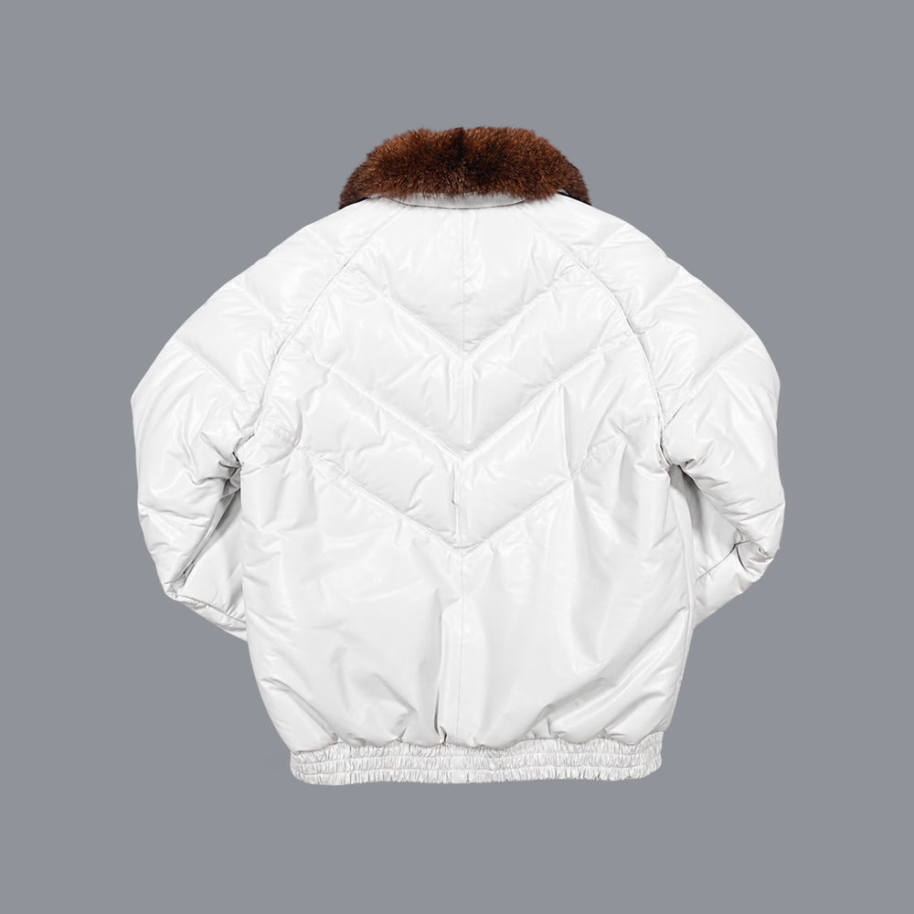Rear view of an off-white leather down bomber with stacked V channels, center seam and gathered waistband